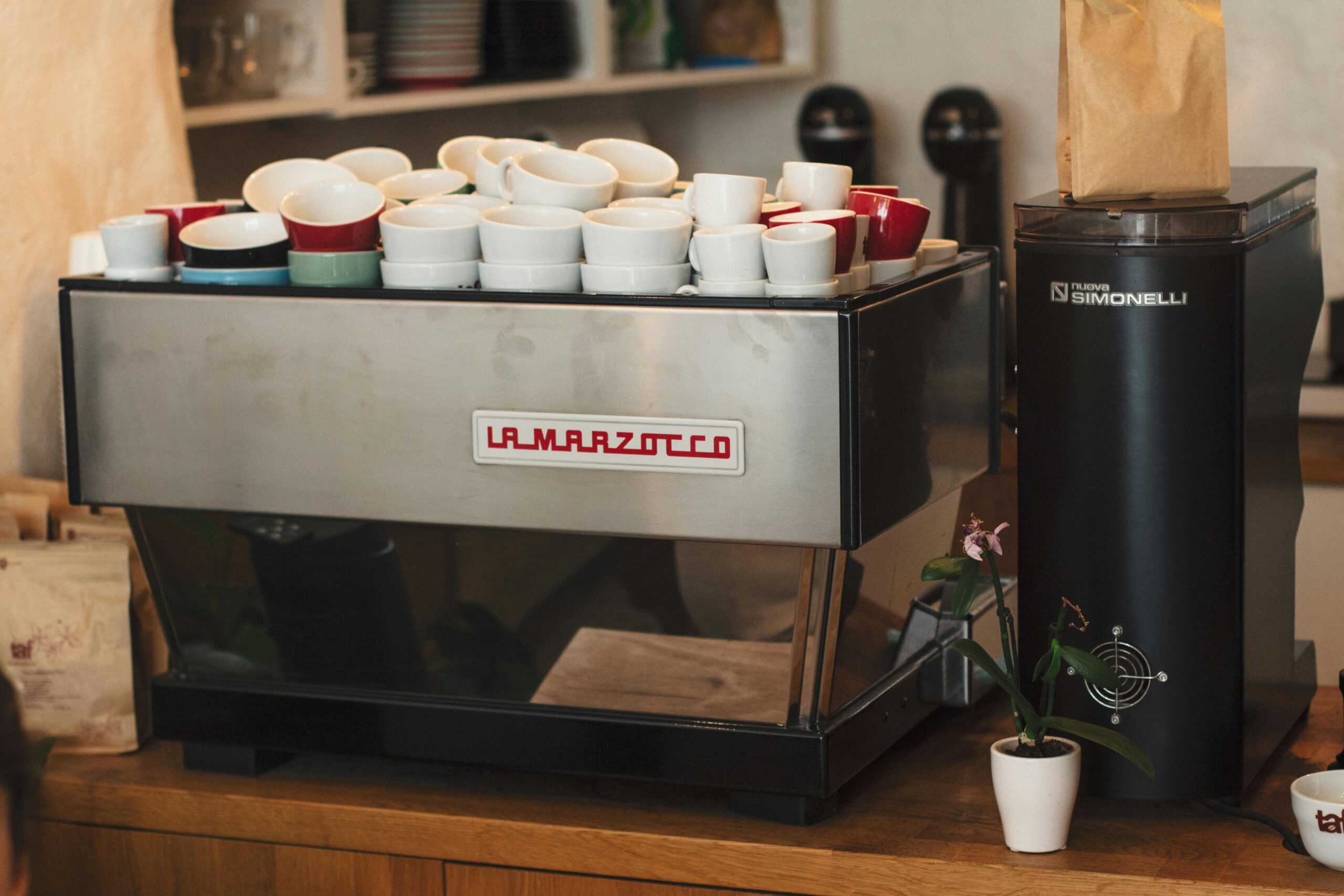 La Marzocco espresso machine with cups in a Colorado cafe showing Peak Coffee Techs repair maintenance and installation service